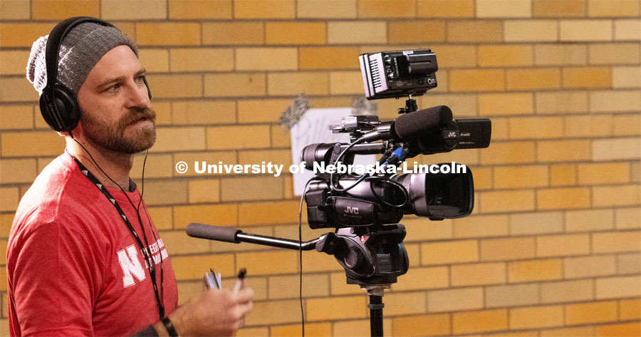 College of Journalism and Mass Communications Broadcast major Brandon Thomas interviews Mike Aerni, site coordinator at the Fremont, Nebraska disaster response distribution center at City Auditorium. April 1, 2019.  Photo by Bernard McCoy / College of Journalism and Mass Communications, University of Nebraska.