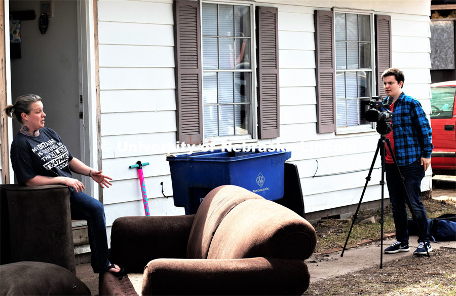 College of Journalism and Mass Communications Broadcast major Jacob Bova interviews Fremont, Nebraska resident Heather Pena outside her flood damaged home. A major flood from the nearby Platte River struck the city on March 13 April 1, 2019.  Photo by Bernard McCoy / College of Journalism and Mass Communications, University of Nebraska.