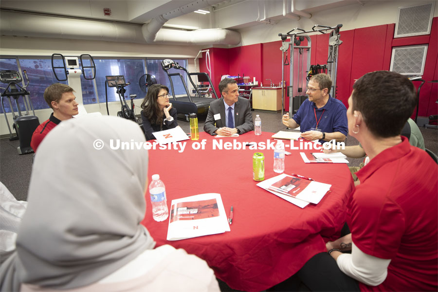 Cary Savage (center), director of Nebraska's Center for Brain, Biology and Behavior, listens to a question from Eric Olson of the Associated Press.Research Media Day held in Nebraska Athletic Performance Lab in east stadium. April 8, 2019. Photo by Craig Chandler / University Communication.