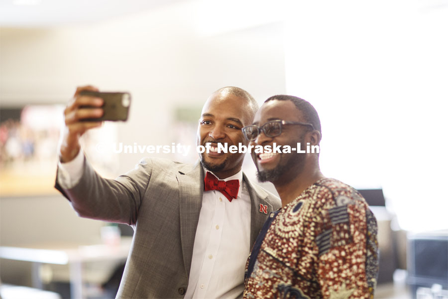 Marco Barker takes a selfie with John Osiri in the Nebraska Union Monday, April 15 2019. Photo by Craig Chandler / University Communication.