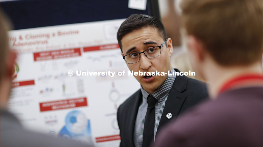 Yaid Puente discusses his research on Sequencing and Cloning a Bovine Adenovirus. Undergraduate Spring Research Fair in the Union ballrooms. April 15, 2019. Photo by Craig Chandler / University Communication.