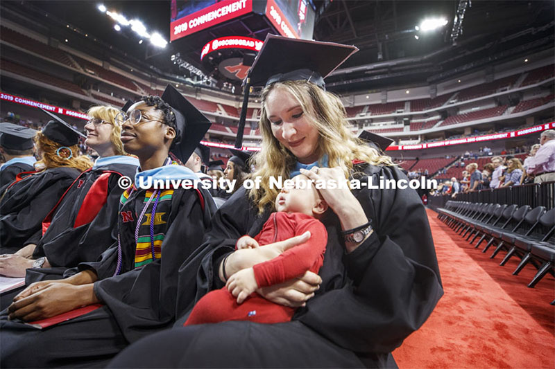 Chelsea Krafka brought her month-and-a-half-old son, Milo, to the ceremony. 2019 Spring Graduate Commencement in Pinnacle Bank Arena. May 3, 2019. Photo by Craig Chandler / University Communication