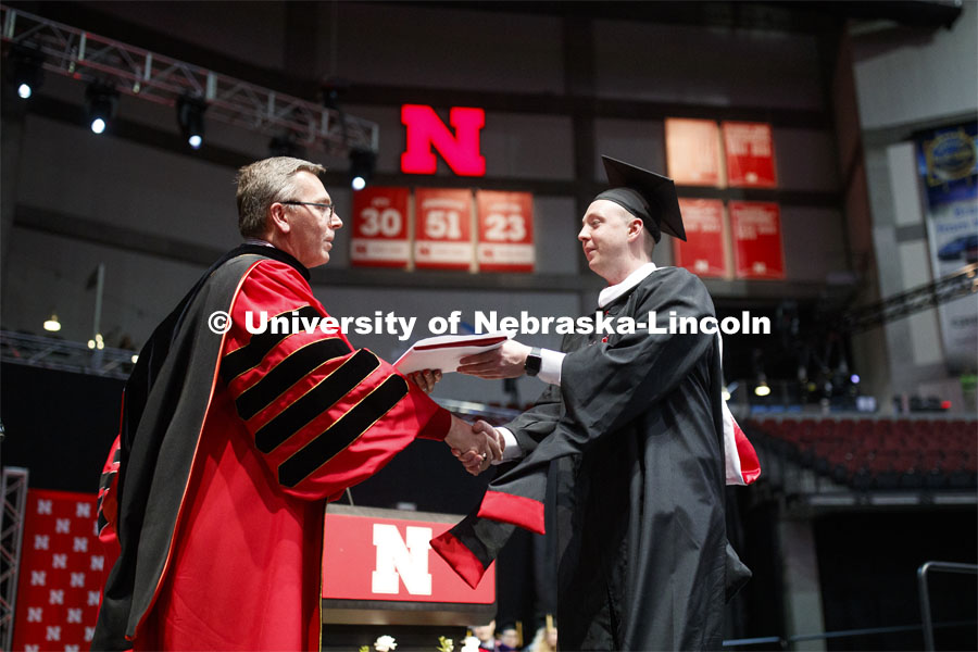 E.J. Stevens receives his master of arts in business degree Friday. 2019 Spring Graduate Commencement in Pinnacle Bank Arena. May 3, 2019. Photo by Craig Chandler / University Communication