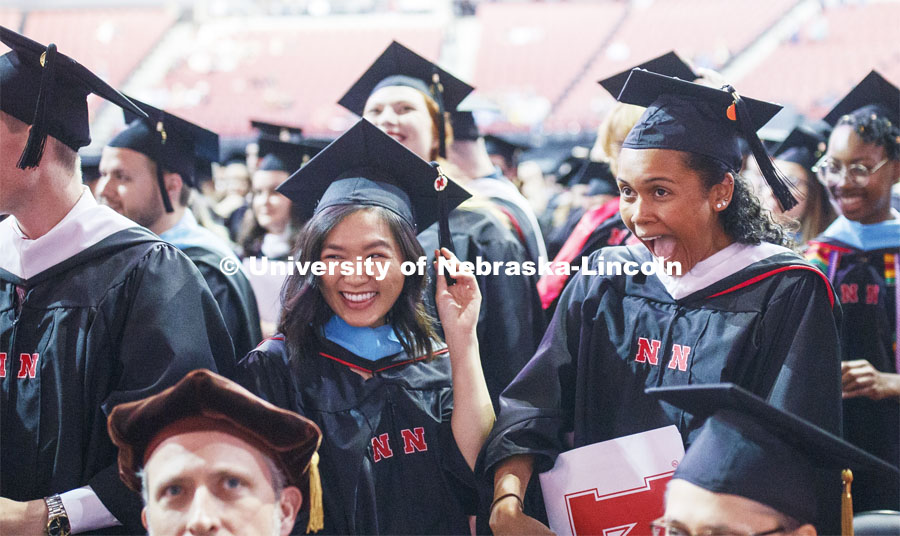 Graduates react after moving their tassels and completing commencement. 2019 Spring Graduate Commencement in Pinnacle Bank Arena. May 3, 2019. Photo by Craig Chandler / University Communication
