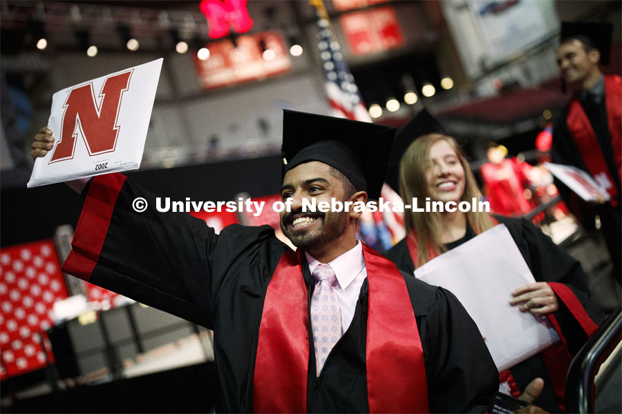 Khaled Saad AlSubaie waves to family and friends as he walks off stage Saturday. Undergraduate commencement at Pinnacle Bank Arena, May 4, 2019. Photo by Craig Chandler / University Communication.