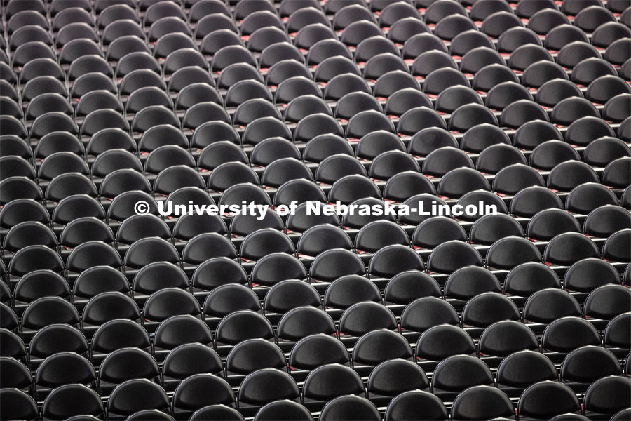 The chairs are neatly lined up for the graduates. Undergraduate commencement at Pinnacle Bank Arena, May 4, 2019. Photo by Craig Chandler / University Communication.
