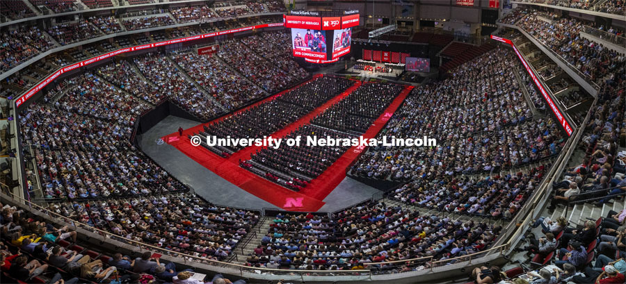 Rebecca Richards-Kortum accepts the Charles Bessey Medal from Chancellor Ronnie Green. Undergraduate commencement at Pinnacle Bank Arena. High angle view of a packed house at the Pinnacle Bank Arena. May 4, 2019. Photo by Craig Chandler / University Communication.