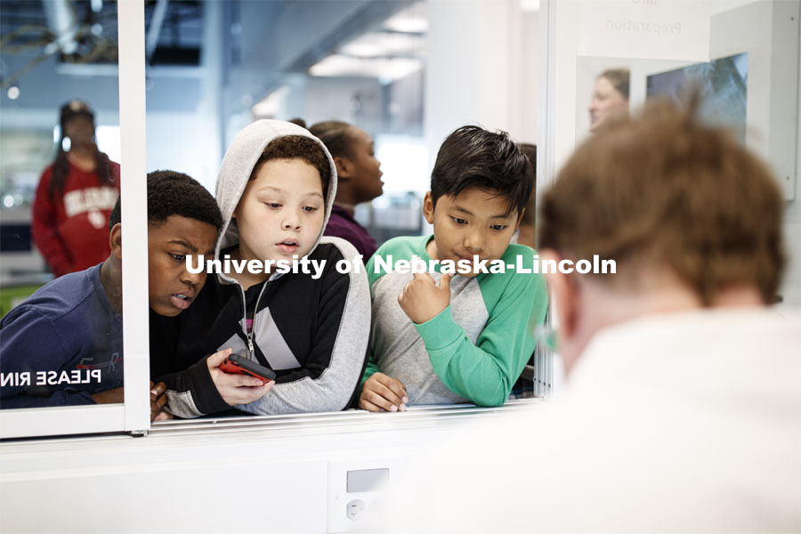 Students on a field trip interact with zoologists in Morrill Hall's Visual Lab on the museum's fourth floor. May 22, 2019. Photo by Craig Chandler / University Communication