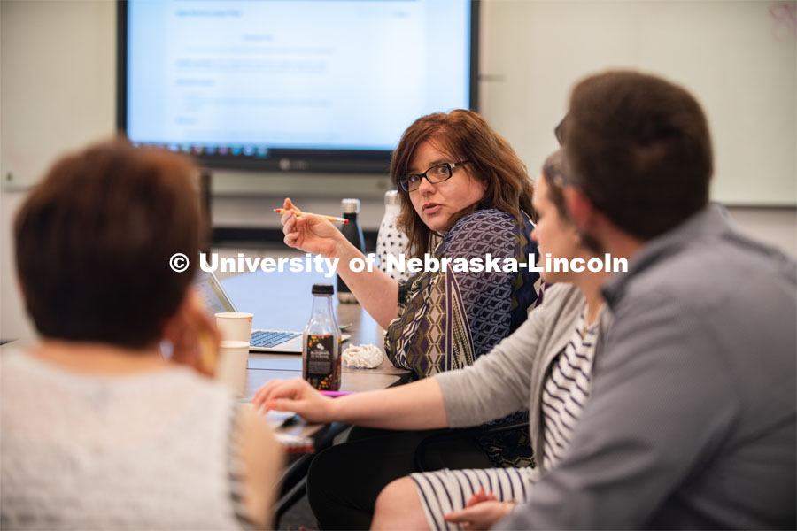 Stacey Haney, a teacher at Humann Elementary, talks with colleagues about classroom opportunities for History Harvest during the teacher institute held June 3-5. June 5, 2019. Photo by Gregory Nathan / University Communication.
