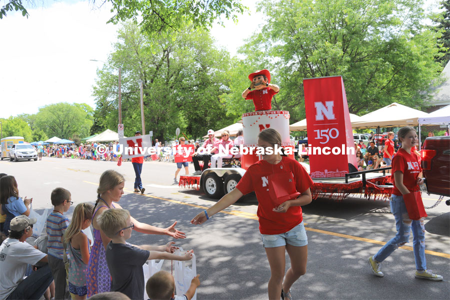 Chancellor Ronnie Green, Jane Green and University Board of Regents member Bob Phares and his wife, Margene Phares, along with Herbie Husker on the UNL Nebraskaland Days parade float in North Platte, NE.  4-H'ers handed out candy along the parade route. The traveling exhibit was displayed at the rodeo grounds. June 15, 2019. Photos by Developing Memories for University Communication.