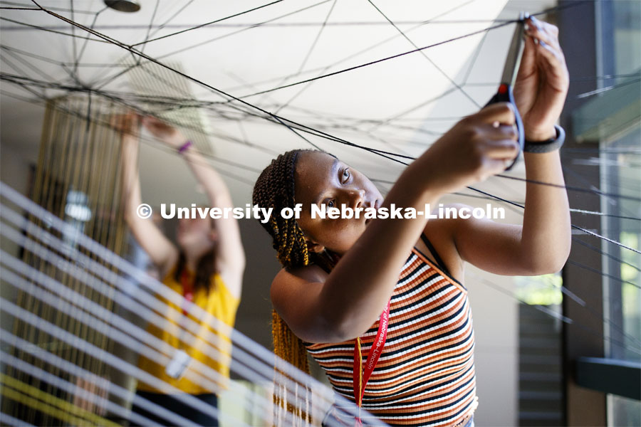 College of Architecture High School Workshop students use string to design in the atrium of the college. June 20, 2019. Photo by Craig Chandler / University Communication.