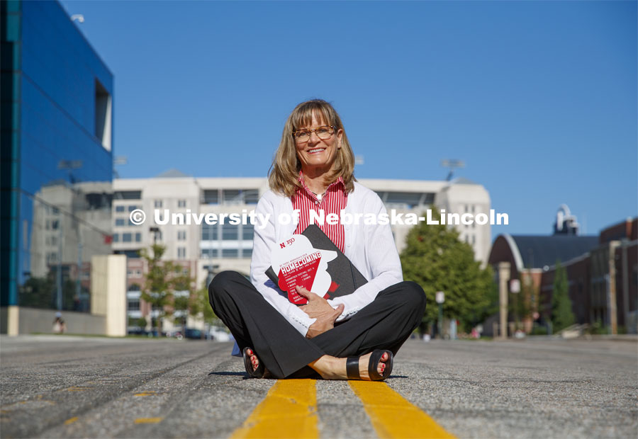 Diane Mendenhall, Associate to the Chancellor for External Engagement, sits along the homecoming parade route on Vine Street. June 24, 2019. Photo by Craig Chandler / University Communication.