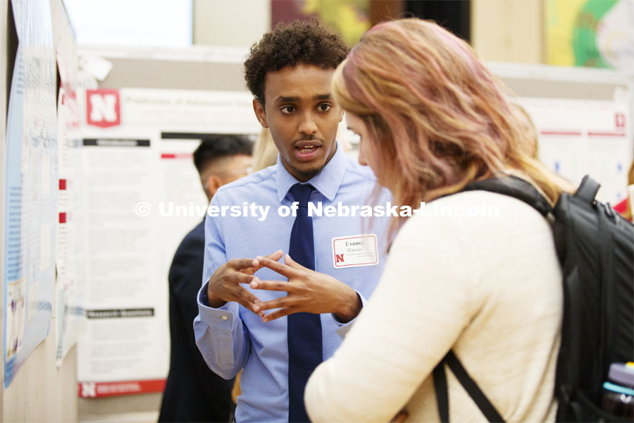 Usama Hassan discusses his summer research on characterization of proline utilization A from Escherichia coli mutant. Summer Research poster session in the Nebraska Union. August 7, 2019. Photo by Craig Chandler / University Communication.