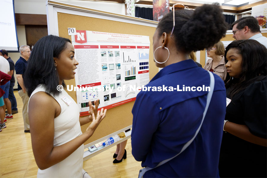 Angelique Malcolm of Purchase College, discusses her summer research on the involvement of Arabidopsis MAP65 in plant immunity. Summer Research poster session in the Nebraska Union. August 7, 2019. Photo by Craig Chandler / University Communication.