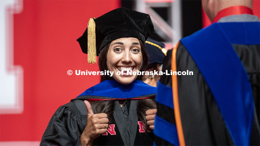 Michelle Haikalis celebrates her doctoral hooding. 2019 Summer Commencement at Pinnacle Bank Arena. August 17, 2019. Photo by Craig Chandler / University Communication.