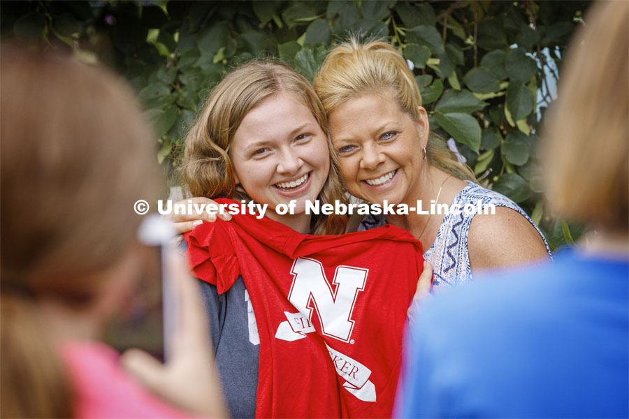 Olivia Burke from Milwaukee, WI, poses with her mom, Mary Anne, and her First Husker t-shirt at the First Husker Welcome. August 18, 2019. Photo by Craig Chandler / University Communication.