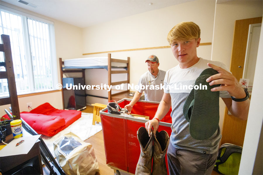 Tyson Olson, an animal science and pre-vet major from Madison, Minnesota, unpacks in his Massengale Residential Center move in. August 21, 2019. Photo by Craig Chandler / University Communication.