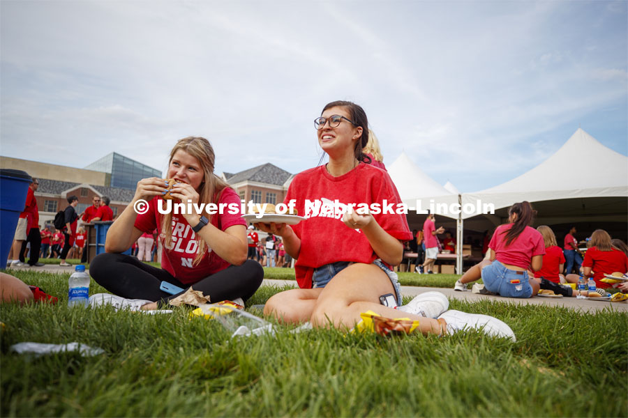 Madi Waltman of Waukee, IA, left, and Brooke Kimpson of Papillion, NE, talk with new friends at the BBQ. Big Red Welcome, Chancellor's BBQ for incoming freshman and new students on the greenspace by the Memorial Union. August 23, 2019. Photo by Craig Chandler / University Communication.