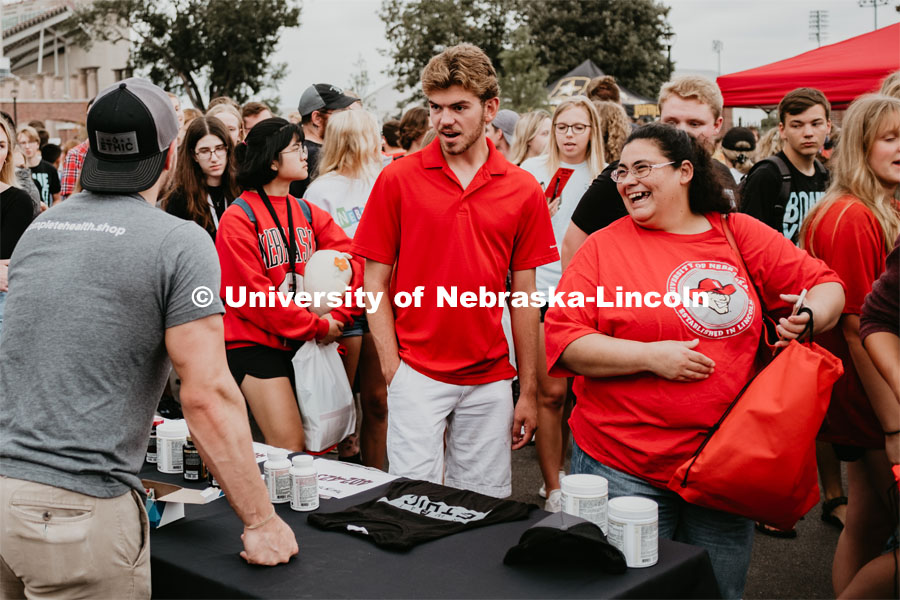 Students getting involved with an RSO. Students had the opportunity to engage with more than 350 booths hosted by local business, student organizations and clubs, UNL departments and more at the Big Red Welcome Street Festival. There were free food, prizes, and giveaways. August 24, 2019. Photo by Justin Mohling / University Communication.