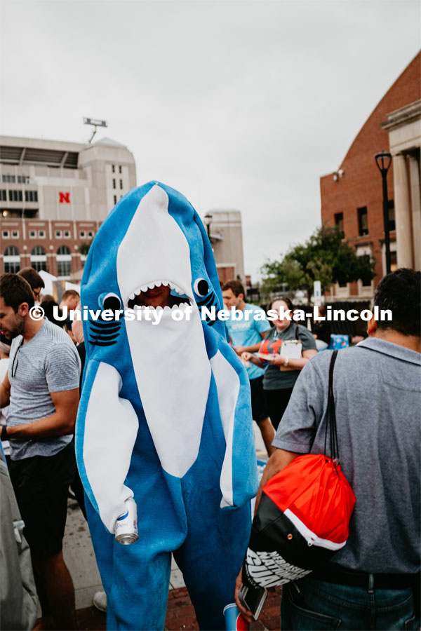 Student dressed as a shark. Students had the opportunity to engage with more than 350 booths hosted by local business, student organizations and clubs, UNL departments and more at the Big Red Welcome Street Festival. There were free food, prizes, and giveaways. August 24, 2019. Photo by Justin Mohling / University Communication.
