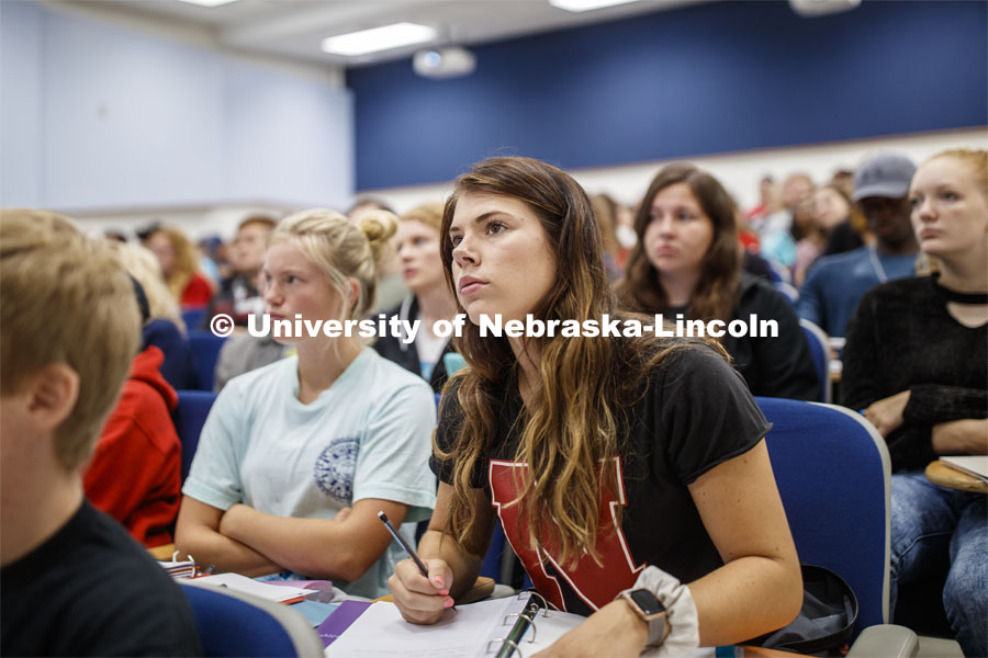 Kaitlyn Draper, a freshman from Pipestone, MN, listens to Eric Malina's CHEM110 first day of class instructions. August 26, 2019. Photo by Craig Chandler / University Communication.