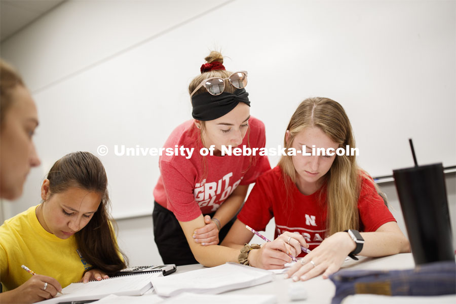 Taylor Hickey, freshman from Elwood, works with Kaelyn Tejral, freshman from Lincoln, during Calculus 106 recitation in Louise Pound Hall taught by Justin Nguyen. August 29, 2019. Photo by Craig Chandler / University Communication.