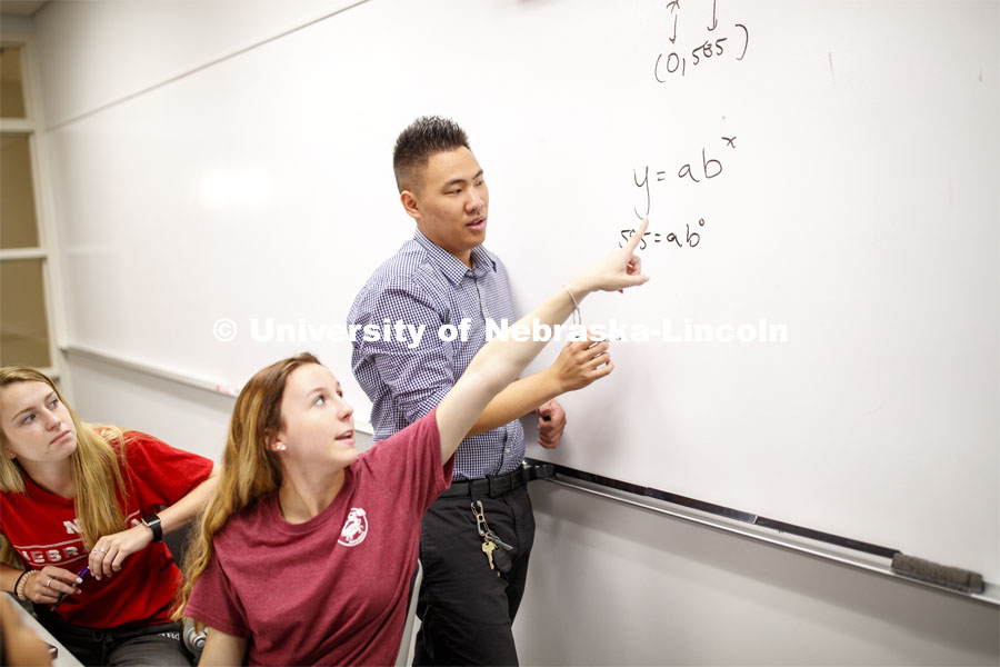 Briell Redd points how she would solve the problem Justin Nguyen has written on the board during Calculus 106 recitation in Louise Pound Hall. August 29, 2019. Photo by Craig Chandler / University Communication.