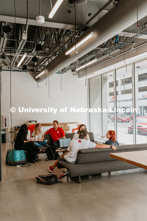 Students studying and socializing by the window in the Johnny Carson Center for Emerging Media Arts. August 30, 2019. Photo by Justin Mohling / University Communication.