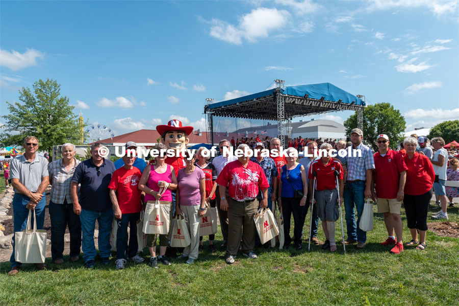 Families of the University Land Grant pose for a photo with Chancellor Ronnie Green and Herbie Husker. Families of the University Land Grant came to show their support at the Nebraska State Fair. The University of Nebraska represents and celebrates their 150th year anniversary at the Nebraska State Fair in Grand Island, Nebraska. August 1, 2019. Photo by Justin Mohling for University Communication.