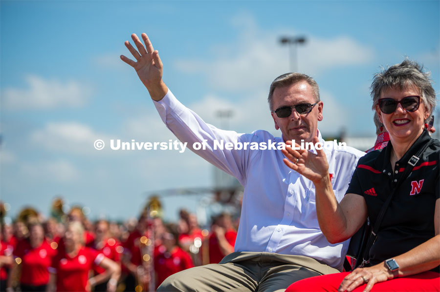 Ronnie and Jane Green waving to parade patrons. The University of Nebraska represents and celebrates their 150th year anniversary at the Nebraska State Fair in Grand Island, Nebraska. August 1, 2019. Photo by Justin Mohling for University Communication.