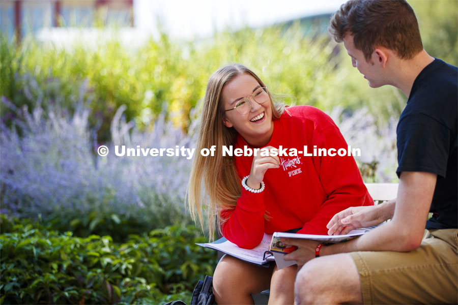 Students sitting at a bench studying. Explore Center photo shoot. September 10, 2019. Photo by Craig Chandler / University Communication.