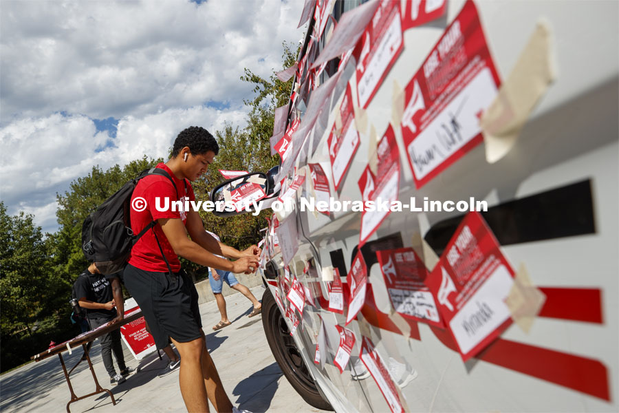 Huskers pledged to speak out and stand up against sexual and relationship violence in the first of a three-day "Cover the Cruiser" initiative. The project encourages students, faculty and staff to sign a “Use Your Voice” pledge card and attach it to a police car. Each card signifies a commitment to help others and speak out against all forms of sexual violence. September 12, 2019. Photo by Craig Chandler / University Communication.