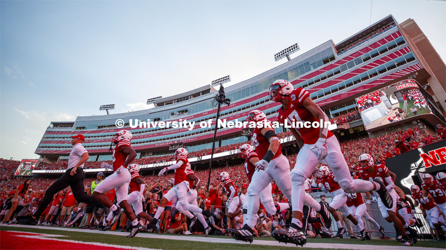 Coach Scott Frost leads his team onto the field for the Nebraska vs. Northern Illinois football game. September 14, 2019. Photo by Craig Chandler / University Communication.