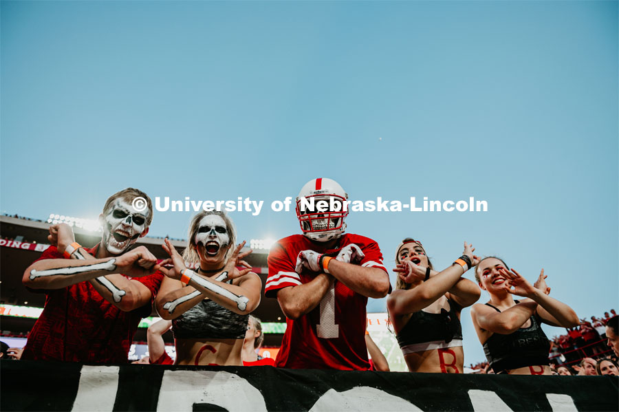 Student section painted up like skeletons, throwing the bones. Nebraska vs. Northern Illinois football game. September 14, 2019. Photo by Justin Mohling / University Communication.