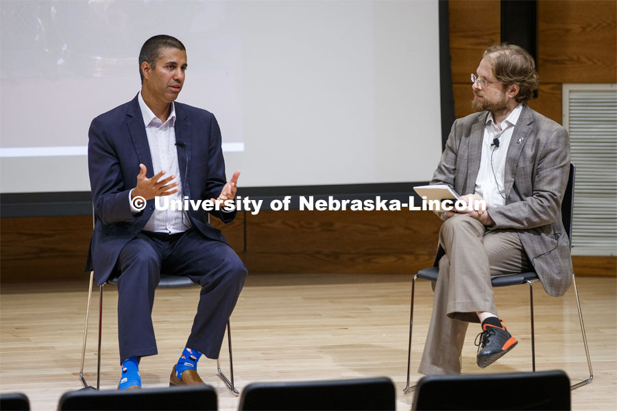 Ajit Pai, chairman of the Federal Communications Commission, and Gus Hurwitz, Co-Director, Space/Cyber/Telecomm Program and College of Law Associate Professor, talk at a fireside chat in the Nebraska Union auditorium. Pai visited the University of Nebraska–Lincoln on Sept. 18. The visit is hosted by the University of Nebraska College of Law’s Space, Cyber and Telecommunications Law program and its co-director Gus Hurwitz. September 18, 2019. Photo by Craig Chandler / University Communication.