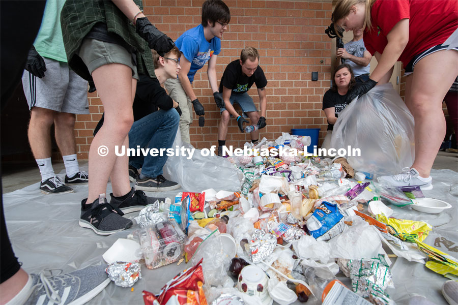 Students from the Environmental Studies Orientation class, including Luke Stursma, (lower left) William Raney, Leo Schwantz, instructor Christine Haney Douglass and Anna Janda sort refuse from lunch at Lincoln Southwest High School. September 25, 2019. Photo by Greg Nathan / University Communication.