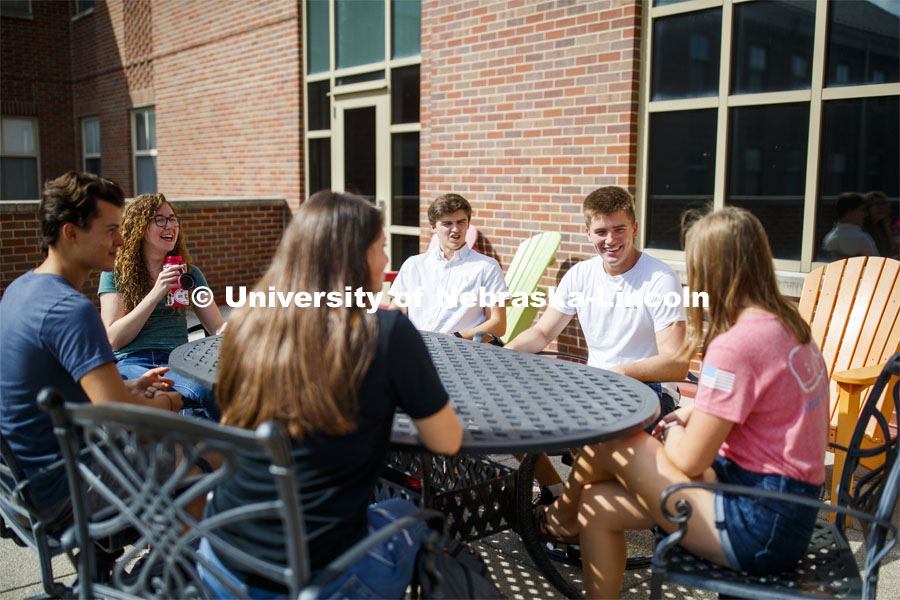 Students hanging out on the roof of the Kauffman Academic Residential Center. Raikes school photo shoot. September 25, 2019. Photo by Craig Chandler / University Communication.