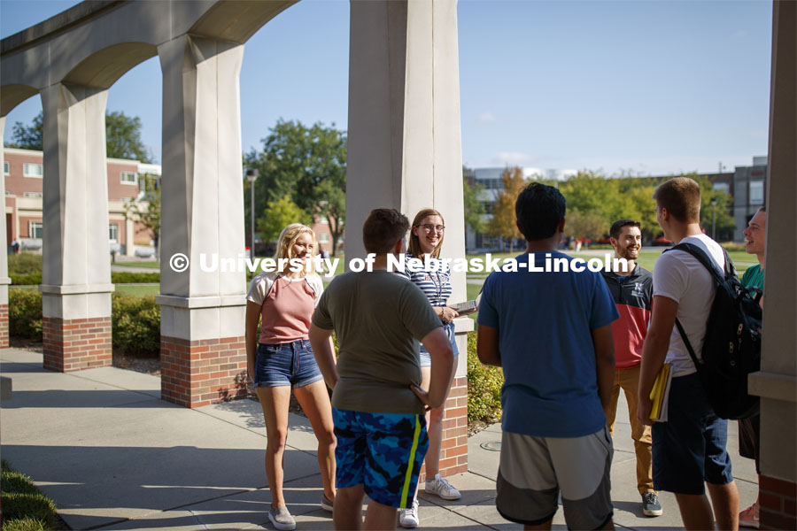 Students hanging out front of the Kauffman Academic Residential Center. Raikes school photo shoot. September 25, 2019. Photo by Craig Chandler / University Communication.