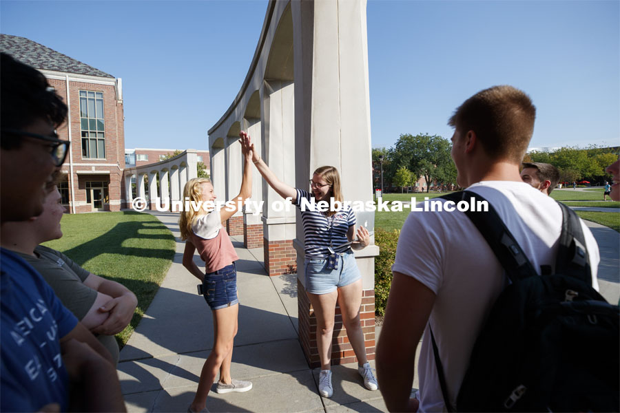 Students hanging out front of the Kauffman Academic Residential Center. Raikes school photo shoot. September 25, 2019. Photo by Craig Chandler / University Communication.