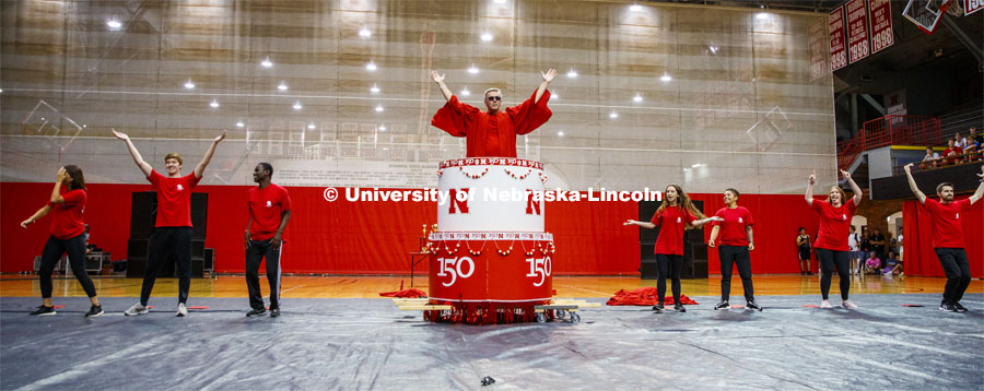 Chancellor Ronnie Green wearing the robe of the Innocents pops out of the N150 birthday cake. Showtime at the Coliseum performances as part of Homecoming week. September 30, 2019. Photo by Craig Chandler / University Communication.