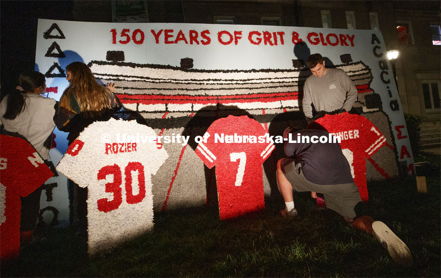 Famous Huskers are memorialized outside of Alpha Tau Omega house. Students from Alpha Tau Omega, Gamma Phi Beta, Delta Delta Delta, Acacia, Sigma Alpha Mu work on their homecoming display. 2019 Homecoming display decorations. October 3, 2019. Photo by Craig Chandler / University Communication.