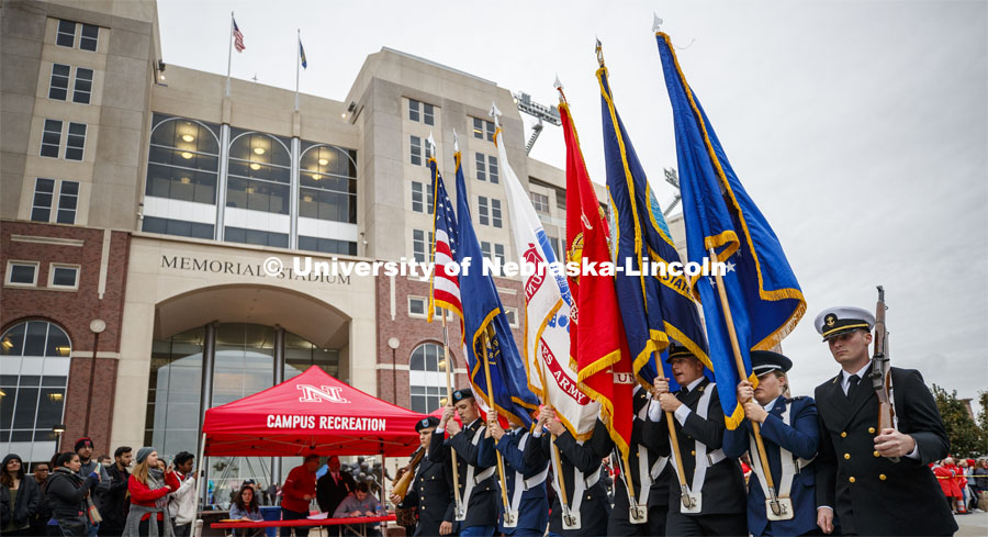 ROTC color guard leads the parade past Memorial Stadium. Cornstock celebration and Homecoming Parade. October 4, 2019. Photo by Craig Chandler / University Communication.