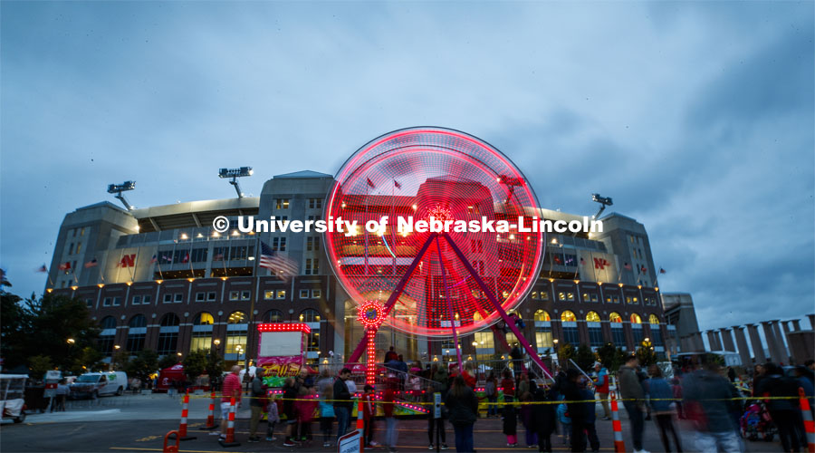 A Ferris wheel on the east side of Memorial Stadium gave its riders a view of the stadium loop. Cornstock celebration and Homecoming Parade. October 4, 2019. Photo by Craig Chandler / University Communication.