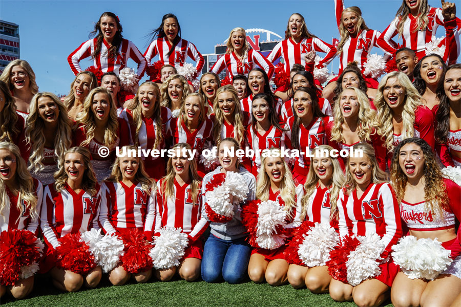 Hannah Huston, from the tv show The Voice, poses with the cheer squad before the game. Nebraska vs. Northwestern University football game. Homecoming 2019. October 5, 2019.  Photo by Craig Chandler / University Communication.