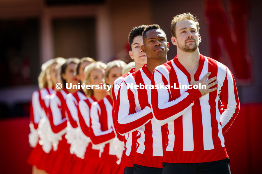 The Cheer Squad lines up and stands to attention for the Pledge of Allegiance. Nebraska vs. Northwestern University football game. Homecoming 2019. October 5, 2019.  Photo by Craig Chandler / University Communication.