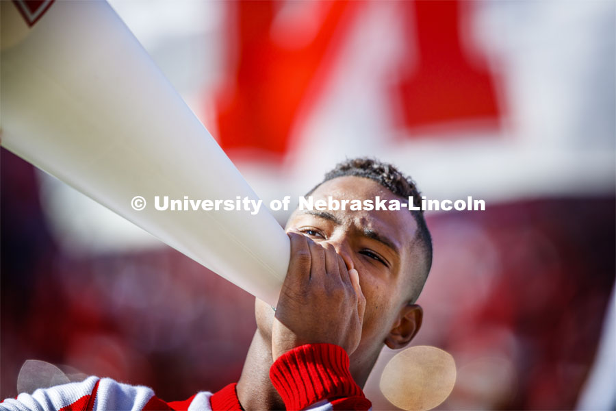 The male cheerleaders use their megaphones to rally the crowd. Nebraska vs. Northwestern University football game. Homecoming 2019. October 5, 2019.  Photo by Craig Chandler / University Communication.