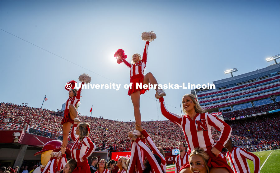 The Cheer Squad perform stunts at the Nebraska vs. Northwestern University football game. Homecoming 2019. October 5, 2019.  Photo by Craig Chandler / University Communication.