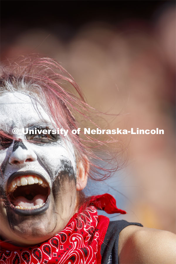 Fans with faces painted like skeletons. Nebraska vs. Northwestern University football game. Homecoming 2019. October 5, 2019.  Photo by Craig Chandler / University Communication.