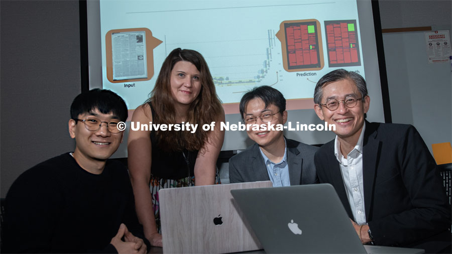 Members of the Aida lab (from left) Chulwood Pack, graduate student; Elizabeth Lorang, associate professor in University Libraries; Yi Liu, graduate student; and Leen-Kiat Soh, professor of computer science and engineering, recently completed research on using machine learning in digital libraries for the United States Library of Congress. October 7, 2019. Photo by Gregory Nathan / University Communication.