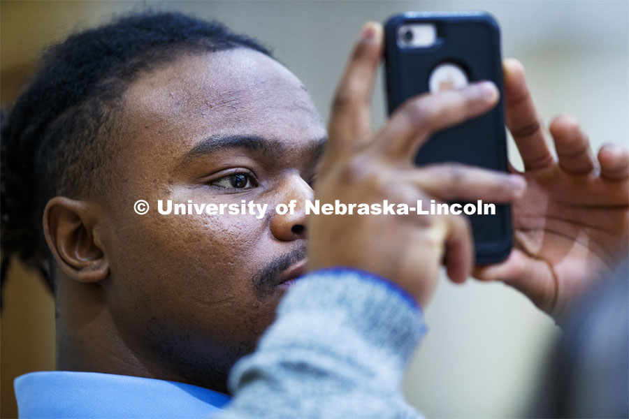 Mikale Wilbon, Graduate Student in Educational Administration, photographs Marco Barker as he gives the State of Diversity. October 29, 2019. Photo by Craig Chandler / University Communication.